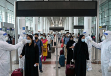 भारत में Nipah virus के मामलों से बढ़ी चिंता, सरकार ने तेज किए रोकथाम के कदम Health officials screening passengers at an international airport as precautionary measures increase during Nipah virus outbreak in India