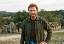 Chuck Norris Dies at 86: Full Story, Career & Truth About Heart Attack Rumors Chuck Norris smiling outdoors in a casual outfit with a scenic background
