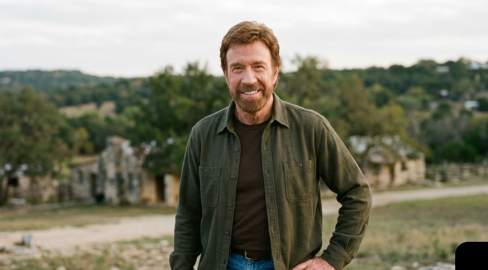 Chuck Norris Dies at 86: Full Story, Career & Truth About Heart Attack Rumors Chuck Norris smiling outdoors in a casual outfit with a scenic background